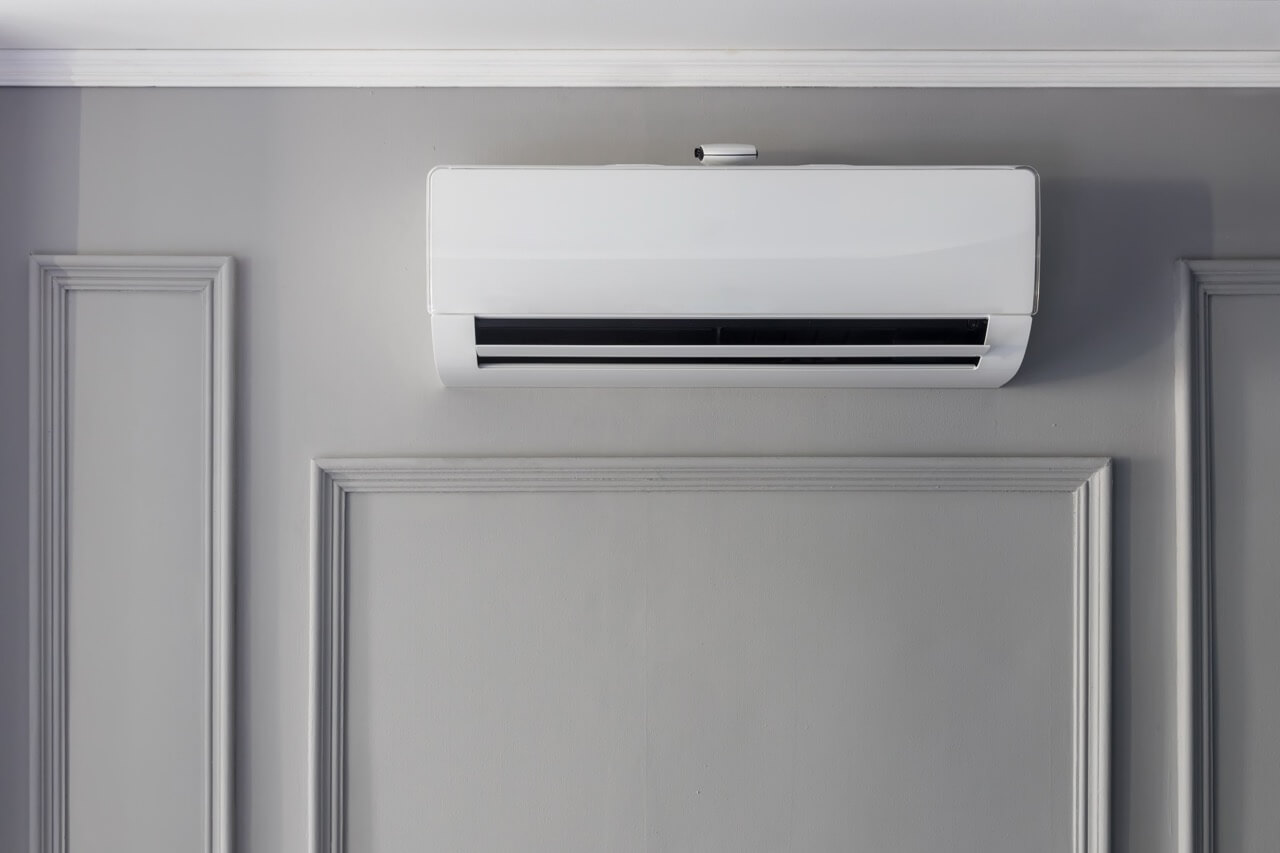 Air conditioner installation on the white wall background. cooling product for hot climate in summer. Air conditioner on wall background