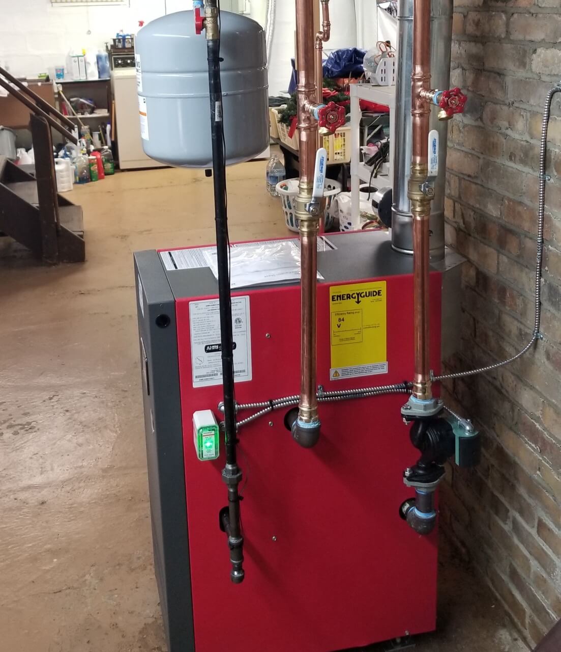 MP Vivo Boiler system in basement with red side panel